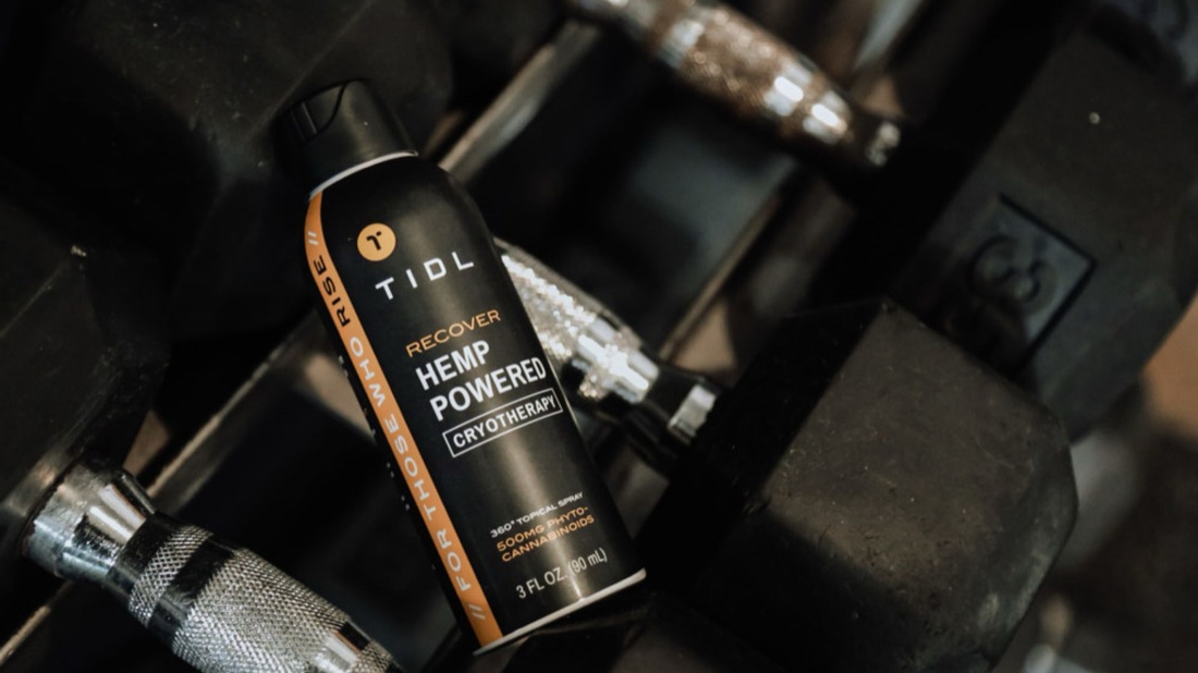 TIDL Sport plant-powered recovery spray in a gym bag