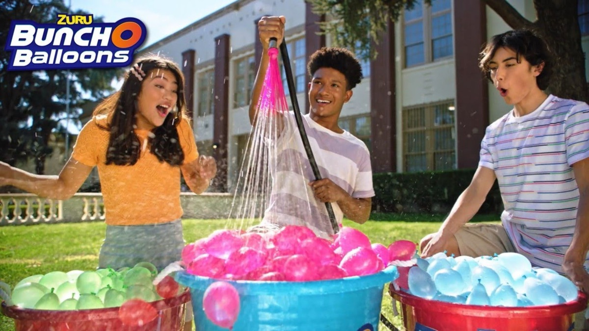 Kids playing with Bunch O Balloons water balloons in a commercial still