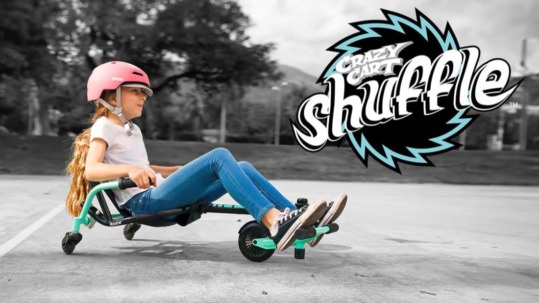 A girl riding the Razor Crazy Cart Shuffle in a commercial still