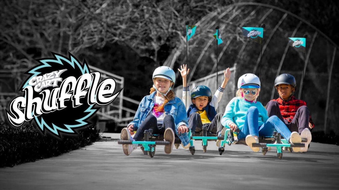 Kids riding the Razor Crazy Cart Shuffle in a commercial still
